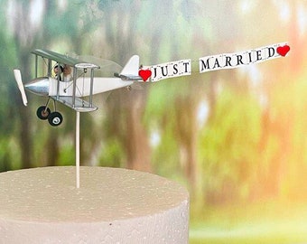 Silver Wedding Airplane Cake topper with custom "Just married" banner.