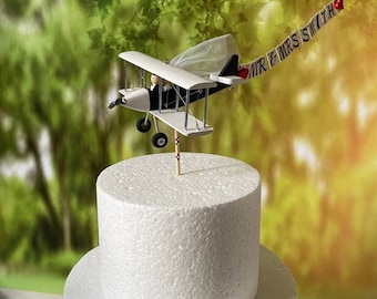 Airplane Wedding Cake Topper with Custom banner Mr. & Mrs. Marriage cute unique honeymoon figurines at the helm of the plane.