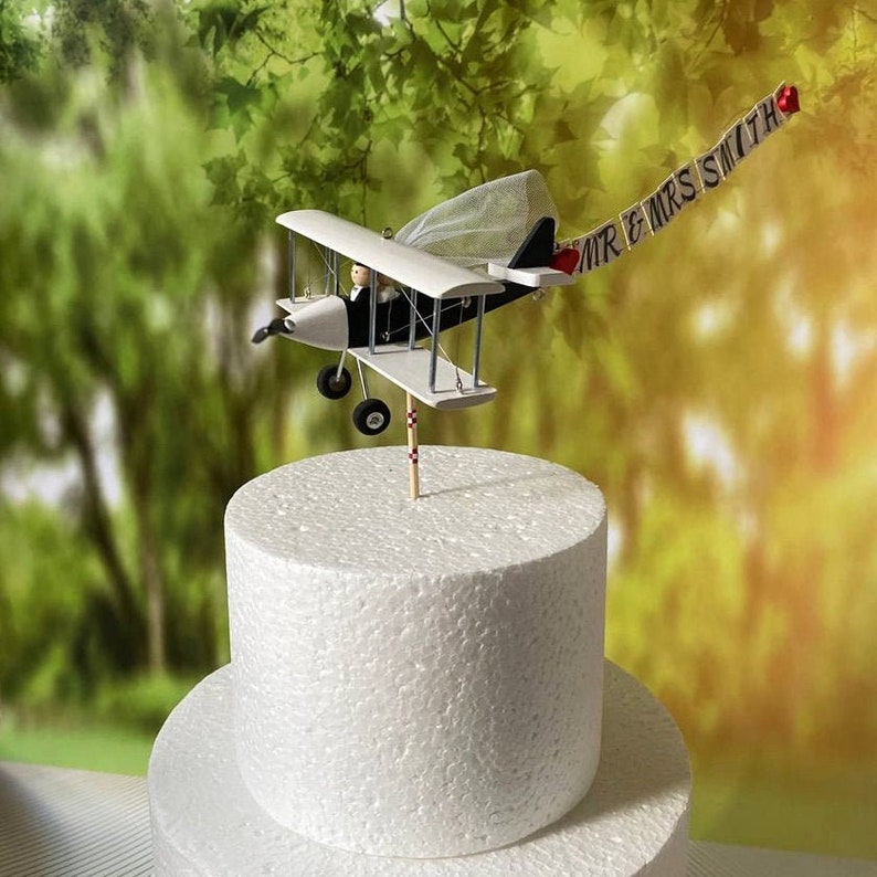 Airplane Wedding Cake Topper with Custom banner Mr. & Mrs. Marriage cute unique honeymoon figurines at the helm of the plane. image 1