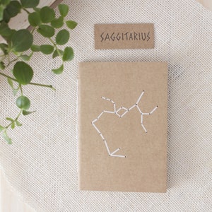 Sagittarius mini notebook with hand-drilled constellation, A6 Eco-friendly hand-sewn kraft journal, Rustic gift for nature & zodiac lovers