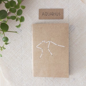 Aquarius zodiac kraft notebook bound by hand, Eco-friendly hand-drilled constellation A6 journal, Rustic & boho gift for sustainable lovers