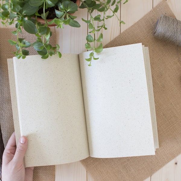 handcrafted binding, eco-friendly notebook made from grass paper, Hand-sewn notebook with a natural texture, Environmentally friendly gift
