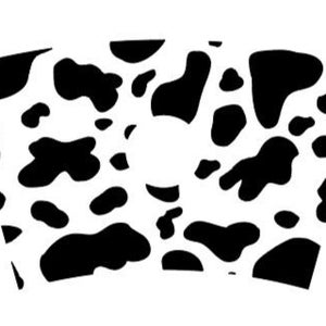 May include: A black and white cow print pattern on a white background. The pattern is in the shape of a cup.