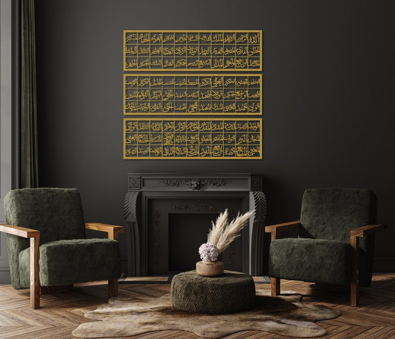 May include: Three gold framed pieces of Islamic calligraphy hang on a black wall above a fireplace. The fireplace has a black mantel and a black interior. There is a green armchair on the right and a green armchair on the left. A small round ottoman sits in front of the fireplace.