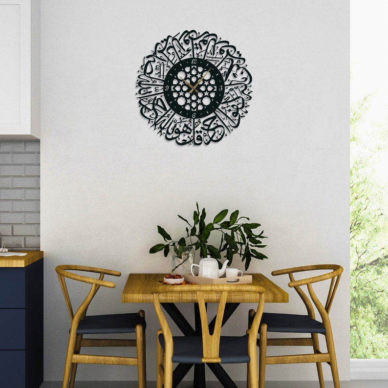 Islamic Wall Art Clock, Home Decoration, Special Best House Gift

🕓EASY TO READ & HANG from hidden hanger. You just need a nail on the wall. Elegant british numerals and hands are contrast for easily reading. Our Surah Al Ikhlas written Islamic caligraphy clock with dimensions options  [29" (75cm) / 24" (60cm) diameter] is produced with 2 mm / 12 gauges iron steel. Product stands 1,5 (0.60") away from the wall; thus it has 3D shadow effect.