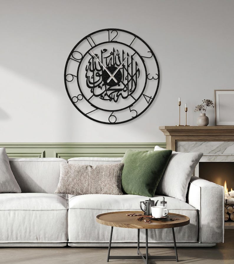 Kalima Tawhid Silent Clock
Note: Please check whether the clock numbers are British or Roman when ordering.

🕓EASY TO READ & HANG from hidden hanger. You just need a nail on the wall. Elegant roman and british numerals and hands are contrast for easily reading. Our [ 24" / 60cm diameter] arabic caligraphy clock is produced with 2 mm / 12 gauges iron steel. Product stands 1,5 (0.60") away from the wall.