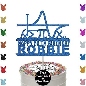 May include: A blue glitter cake topper featuring mathematical symbols and the words "HAPPY 50TH BIRTHDAY ROBBIE". The topper sits atop a cake with sprinkles. Includes a clear stick and glue dots.