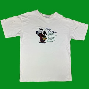 Camiseta bordada de Pepe Le Pew de Warner Bros. de época – ACME Clothing Co