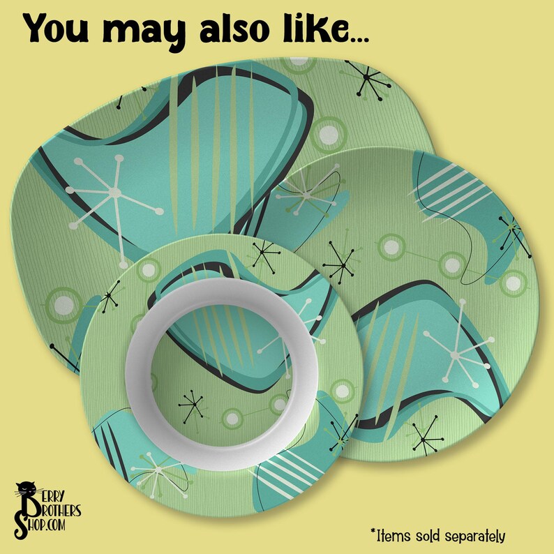 May include: A set of four ceramic plates with a retro atomic design in shades of teal, black, white, and green. The plates feature a variety of shapes and sizes, including a dinner plate, a salad plate, and a bowl. The text "You may also like..." is at the top.