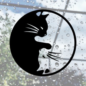 May include: Black and white yin yang symbol with a silhouette of a cat on one side and a silhouette of a mouse on the other side.