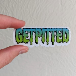 May include: A white sticker with the text "GET PITITED" in dripping green and blue letters. The letters are outlined in black.