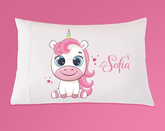 May include: White pillowcase with a pink and white unicorn illustration and the name "Sofia" in pink lettering.