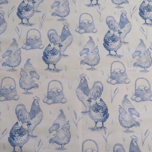 May include: A repeating pattern of blue chickens, roosters, and baskets of eggs on a white background. The design has a hand-drawn, watercolor style, with details like wheat stalks and individual eggs.