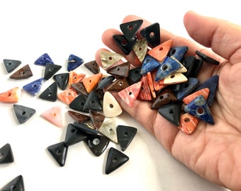 Huge selection of stone and shell triangle cabochons.