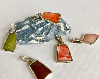 Handmade trapezoid pendants with natural stones and shells set in sterling silver