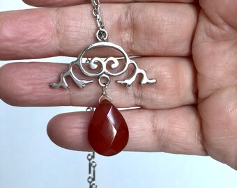 Sterling silver hand-carved pendant with carnelian accent long necklace