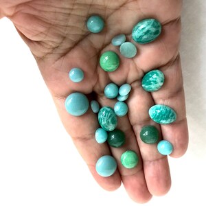 Small round and oval semiprecious green stones