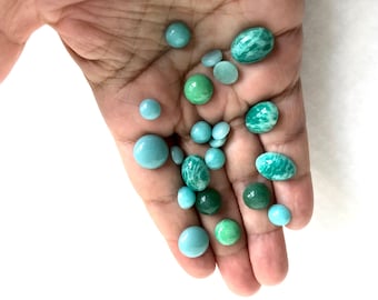 Small round and oval semiprecious green stones