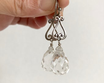 Beautiful faceted crystal drop earrings with intricate sterling silver findings.