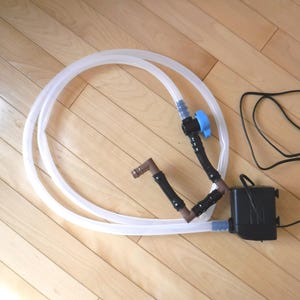 Aquarium water change pump with shut-off manual valve, hang-on hook, and 6 feet silicon tube length
