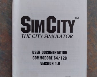 May include: A black and white manual for the SimCity video game for the Commodore 64/128. The manual has the title "SimCity" and the text "The City Simulator". The manual also has the text "User Documentation" and "Version 1.0". The manual has the Maxis logo on the bottom right corner.