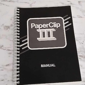 Puede incluir: Manual en blanco y negro con espiral para el software PaperClip III.