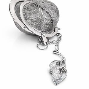 Infusor de hojas de té sueltas con dije de lirio