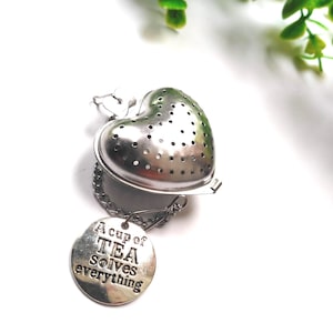 A “Cup of Tea Solves Everything” Tea Infuser – Stainless Mesh Ball – Loose Leaf Steeper with Quote Charm – Gift for Tea Lovers