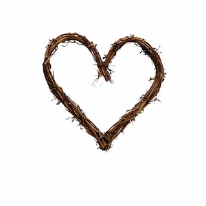 May include: A heart-shaped wreath made from interwoven brown twigs. The rustic design has a natural, organic aesthetic, suitable for home decor or craft projects. The heart is centered on a white background.