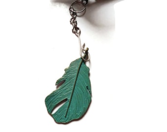 Infuseur à thé avec breloque plume vert turquoise pour infuser vos mélanges de thé