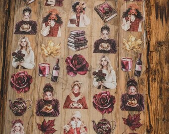 May include: A sheet of decorative stickers with watercolour illustrations. The stickers depict women, books, roses, pumpkins, teapots, candles, and autumn leaves. The colour scheme features burgundy, cream, and brown tones.