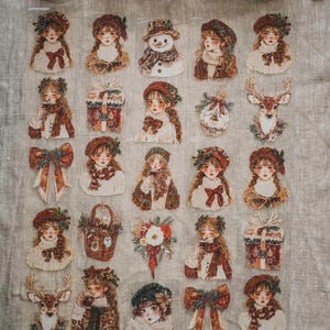 May include: A sheet of decorative stickers featuring vintage-style illustrations. The stickers depict girls, a snowman, gifts, bows, a deer, and floral arrangements in a warm color palette of browns, reds, and creams.