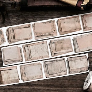 May include: Vintage-style washi tape and paper ephemera strips with aged paper textures, paper clips, and printed documents. The image also includes two rolls of washi tape with the word "Document" visible on one roll.