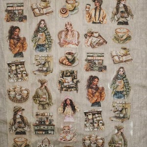May include: A sheet of coffee-themed stickers featuring illustrations of people, coffee cups, espresso machines, and pastries. The stickers have a vintage, hand-drawn style with warm color tones, perfect for scrapbooking or decorating.