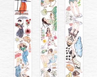 May include: Three vertical sticker strips featuring watercolor illustrations of women in various settings. The scenes include women reading, relaxing, and enjoying leisure activities. The color palette is soft, with pastel hues and detailed artwork.