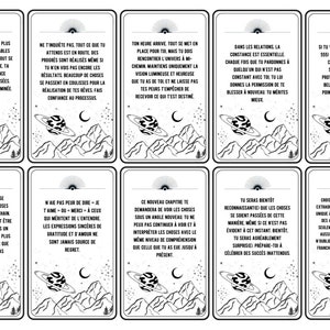 May include: A set of ten black and white cards with inspirational quotes in French. Each card features a stylized mountain range, a crescent moon, and a planet with rings. The cards are designed to be used for self-reflection and motivation.
