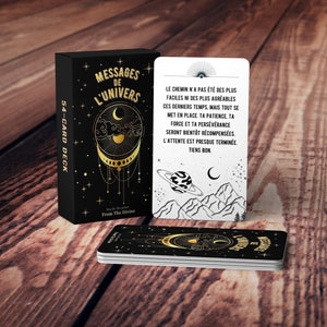 May include: A deck of 54 cards with a black background and gold accents. The cards feature a celestial design with a crescent moon, stars, and a planet. The box has the text "Messages de l'Univers" and "54-Card Deck".