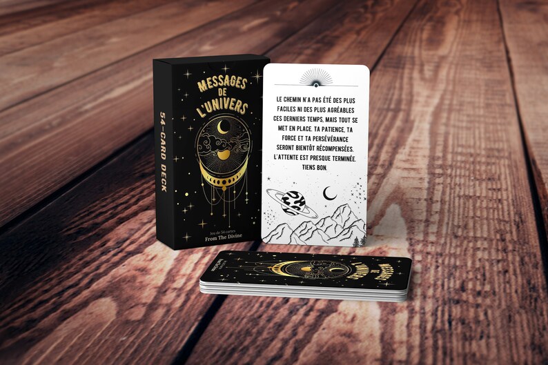 May include: A deck of 54 cards with a black background and gold accents. The cards feature a celestial design with a crescent moon, stars, and a planet. The box has the text "Messages de l'Univers" and "54-Card Deck".