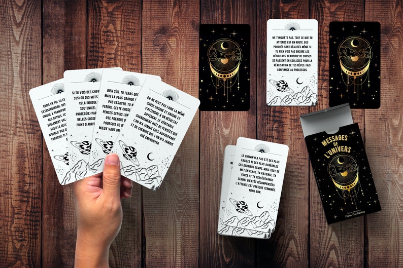 May include: A deck of cards with black and white illustrations of planets and stars. The cards have messages about the universe written on them. The box for the cards is black with gold accents and says "Messages of the Universe" on the front.