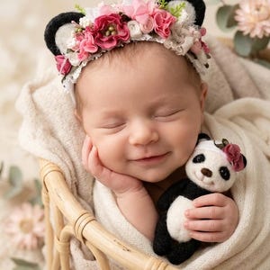 May include: A floral headband featuring black felt animal ears adorned with pink and white fabric flowers, paired with a small plush panda toy wearing a matching pink flower accessory, both designed for decorative use in photography sessions.