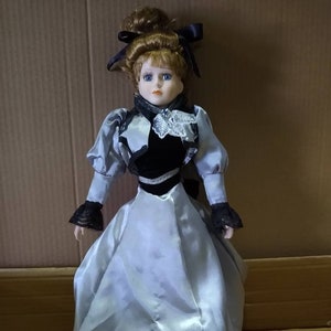 Beautiful Porcelain Doll in Silver and Black Gown