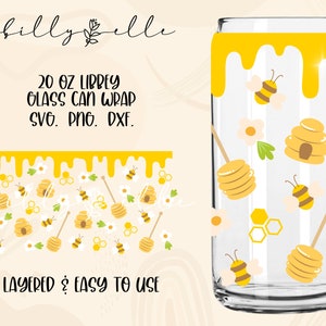 May include: A 20 ounce Libbey glass can wrap design featuring a yellow dripping honey background with bees, honeycombs, and flowers. The text "20 oz Libbey Glass Can Wrap SVG. PNG. DXF." and "LAYERED & EASY TO USE" is included in the design.
