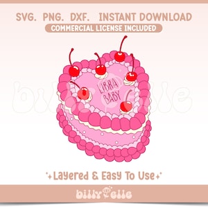 May include: Pink heart-shaped cake with white frosting and red cherries. The cake is decorated with the words "Libra Baby".