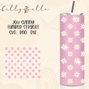 May include: A 20 oz skinny tumbler with a straight design featuring a white daisy pattern on a pink background. The tumbler is shown with a silver lid and straw.