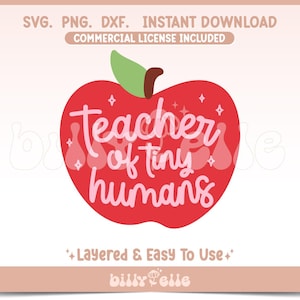 May include: Red apple with a green stem and leaves. The apple has white text that says "teacher of tiny humans" with a sparkle design.