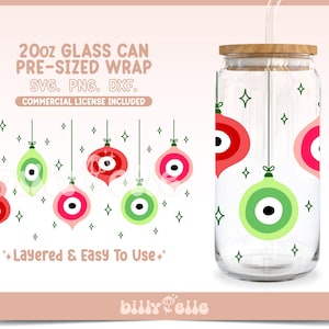 May include: A 20oz glass can wrap design featuring a repeating pattern of red, green, and pink Christmas ornaments with a black eye design. The design is layered and easy to use. The text "20oz GLASS CAN PRE-SIZED WRAP SVG. PNG. DXF. COMMERCIAL LICENSE INCLUDED" is at the top of the image.