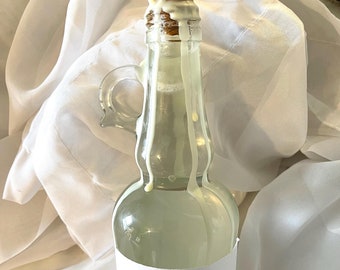 Baño de burbujas líquido de lujo en elegante botella de vidrio