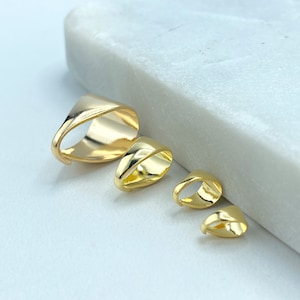 May include: Four gold-toned metal pendant bails of different sizes. The bails are oval-shaped with a smooth, shiny finish.