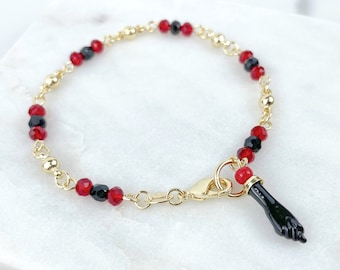 Gold baby bracelet deals with black fist