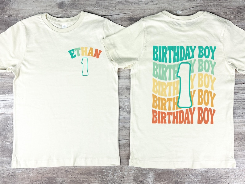 two birthday shirts with the number 1 on them